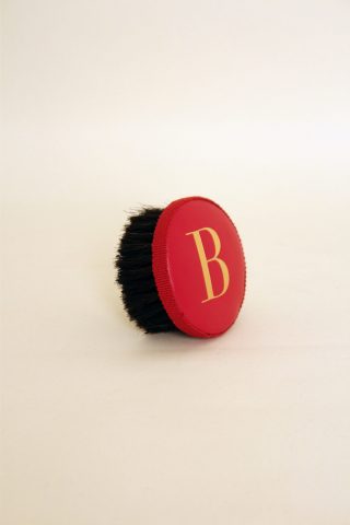 Brush with embossed letter B