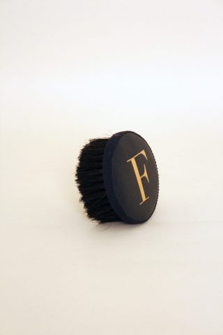 Brush with embossed letter F
