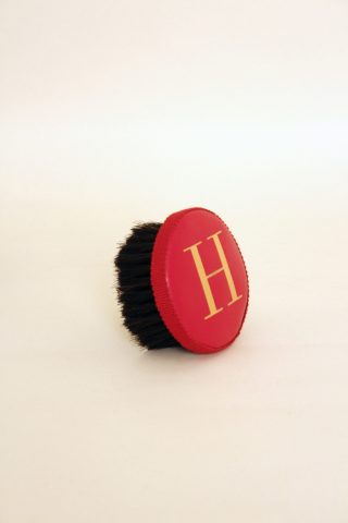 Brush with embossed letter H