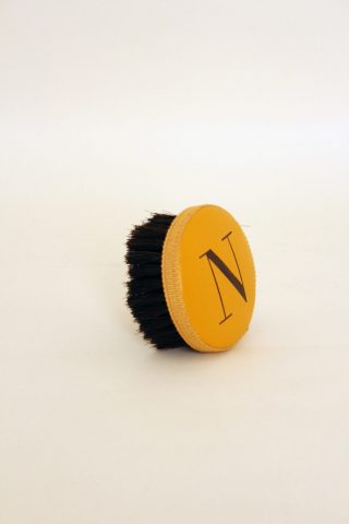 Brush with embossed letter N