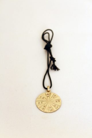 Chiselled and repoussé brass medallion